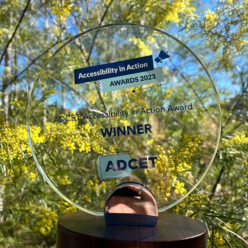 Photo of ADCET's Accessibility in Award Trophy with trees in the background
