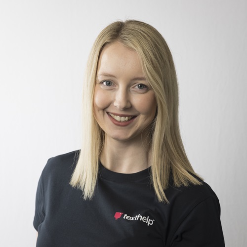 An image of Rachel Coathup, a woman with long blonde hair smiling and wearing a black Texthelp tshirt