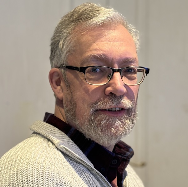 Joe Houghton, short white hair and beard, wearing glasses