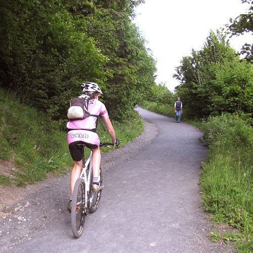 Person riding up a steep hill