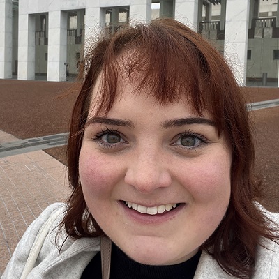 Headshot of Kay Barnard, smiling at the camera