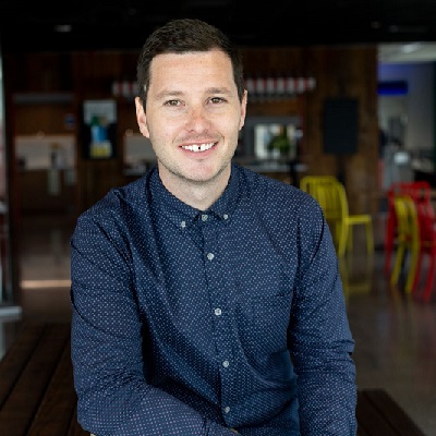 Photo of Conor McHoull wearing a dark blue shirt