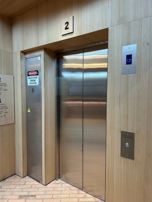 An elevator with the button on the right hand side. 