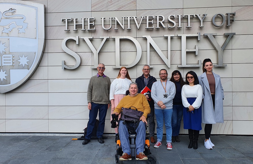 DAWN steering committee standing in front of University of Sydney building.
